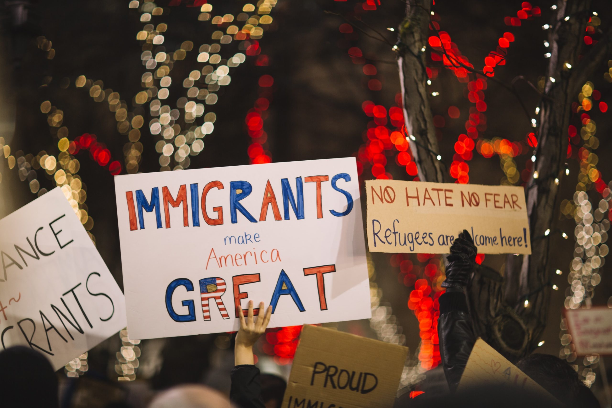 Homepage banner Picture of signs from an immigration related protest.